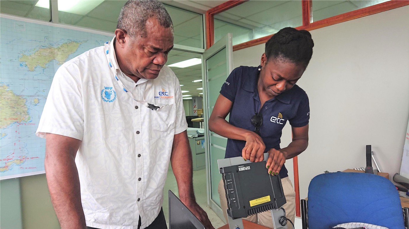 The ETC Coordinator and the Telecommunications Project Officer from Fiji’s National Disaster Management Office prepare Inmarsat equipment for deployment. Photo: Fiji NDMO