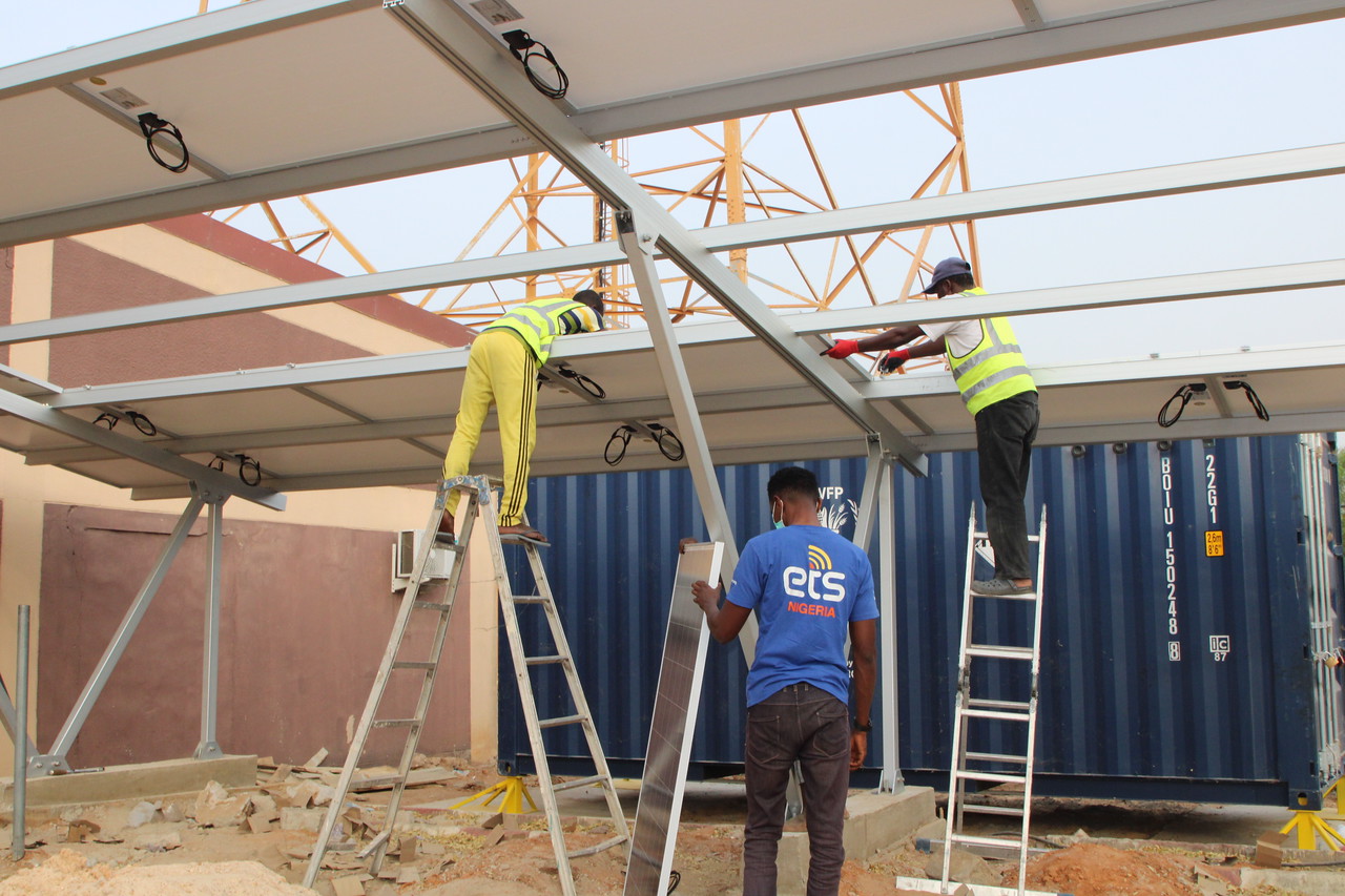 A site hosting critical security telecommunications equipment in Maiduguri gets set up with solar power.