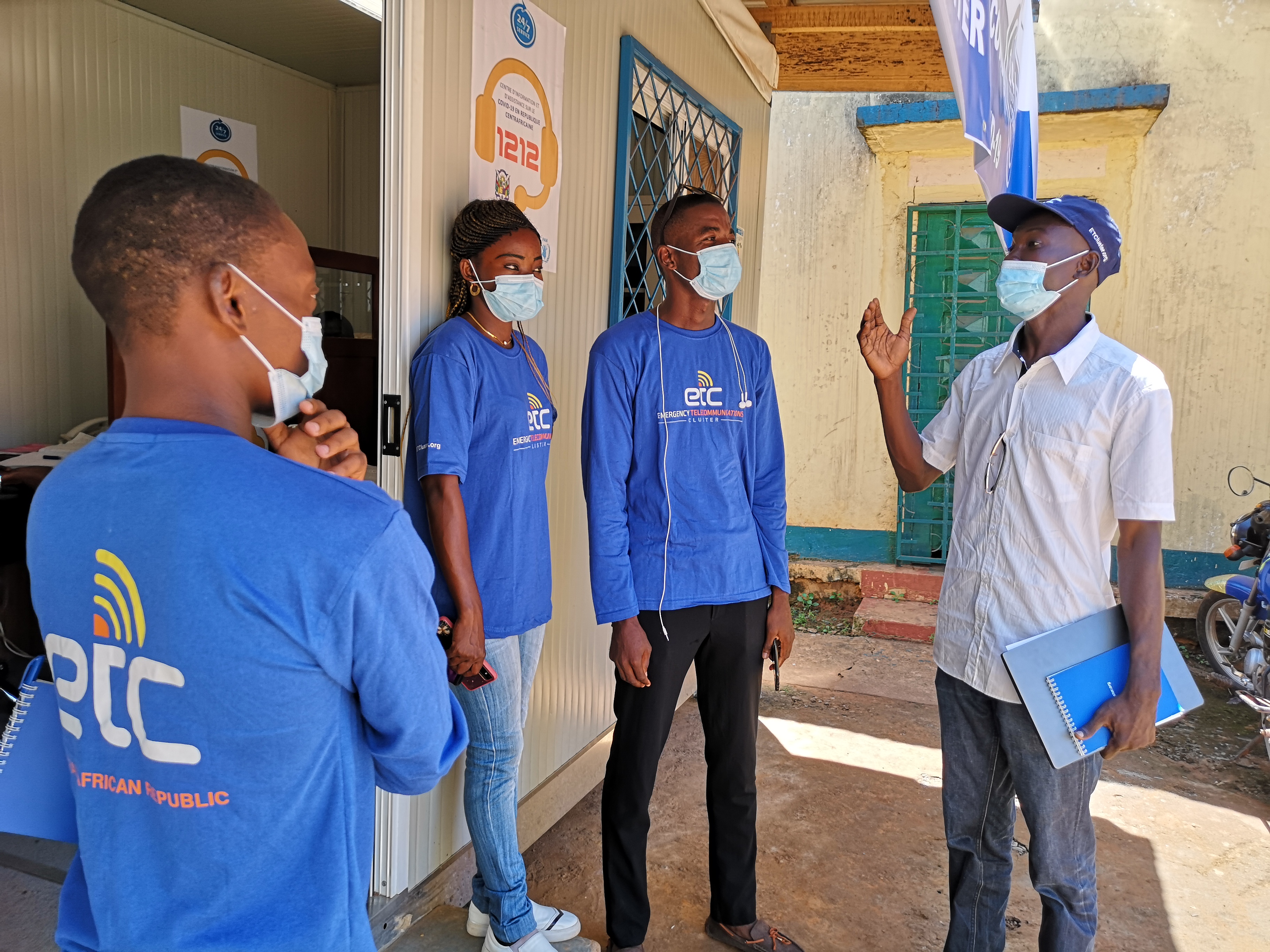Modiana (right), gives his team instructions at the 1212 call centre which has become an interface between the people of CAR and the national Ministry of Health. Photo: WFP/Elizabeth Millership