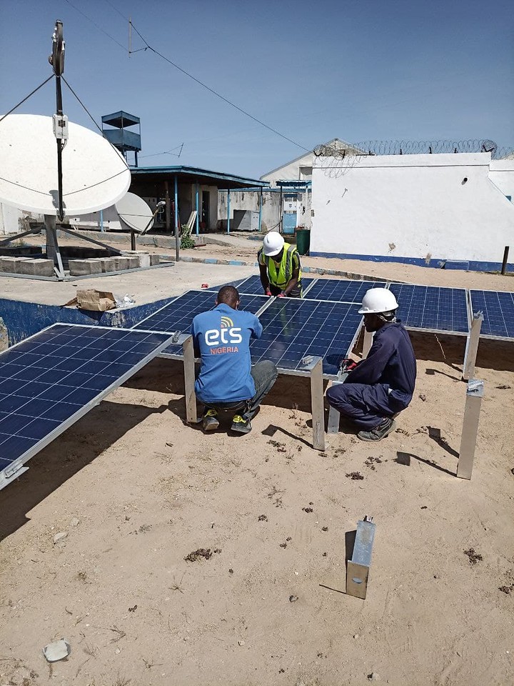 Solar panels are prepared by ETS IT Assistant Ahmed Yusuf Maiinji for installation in Banki's large humanitarian hub