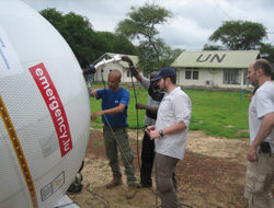 The team adjust the feed horn. The team adjust the feed horn.