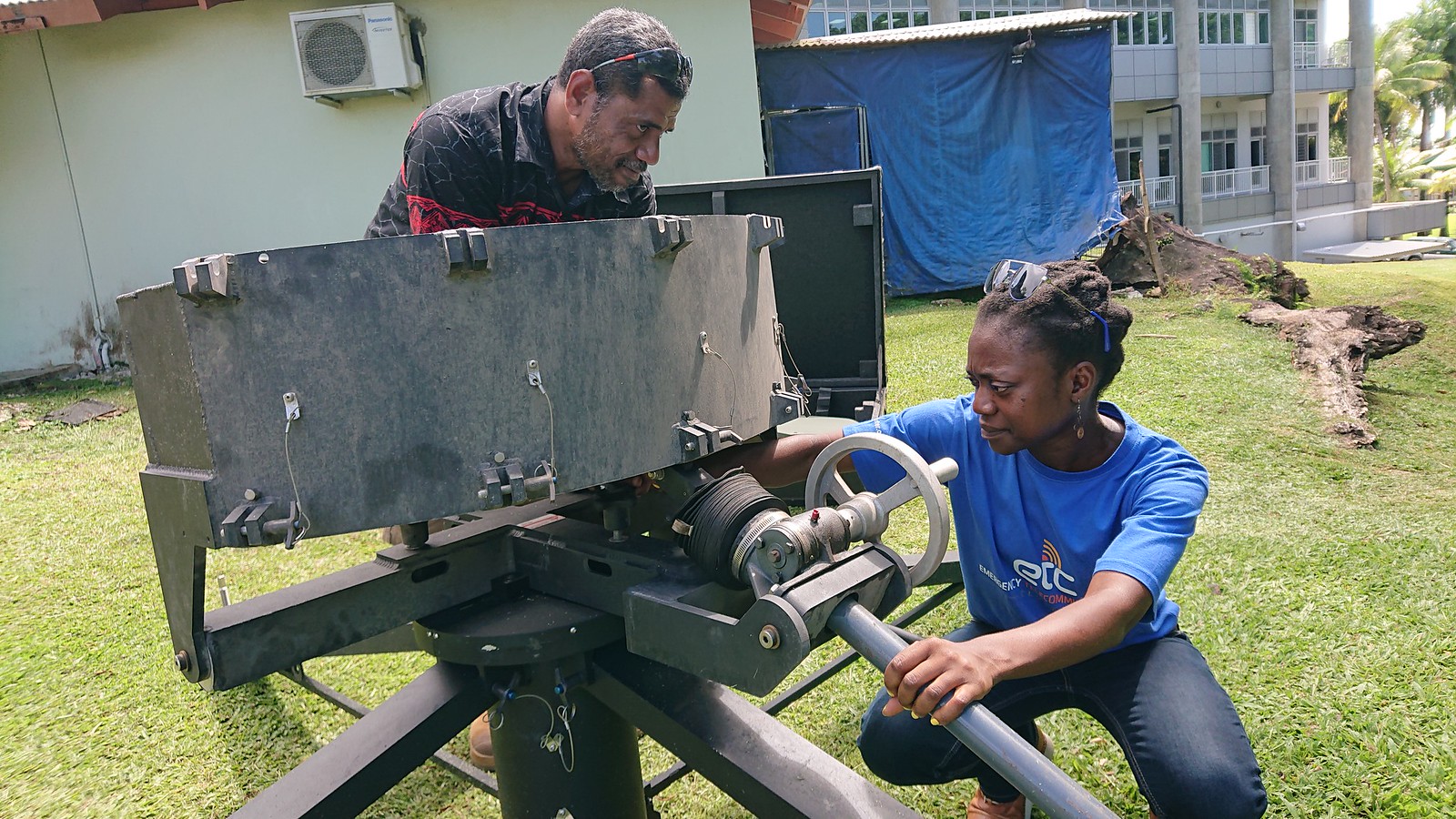 The ETC Coordinator assists a local partner in Fiji to test rapid-deployment satellite equipment